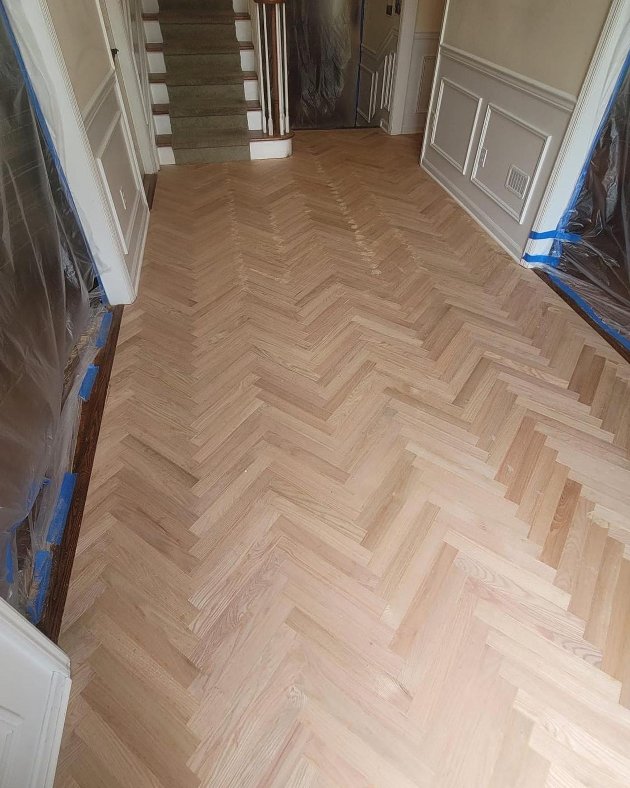 Freshly installed herringbone hardwood floor