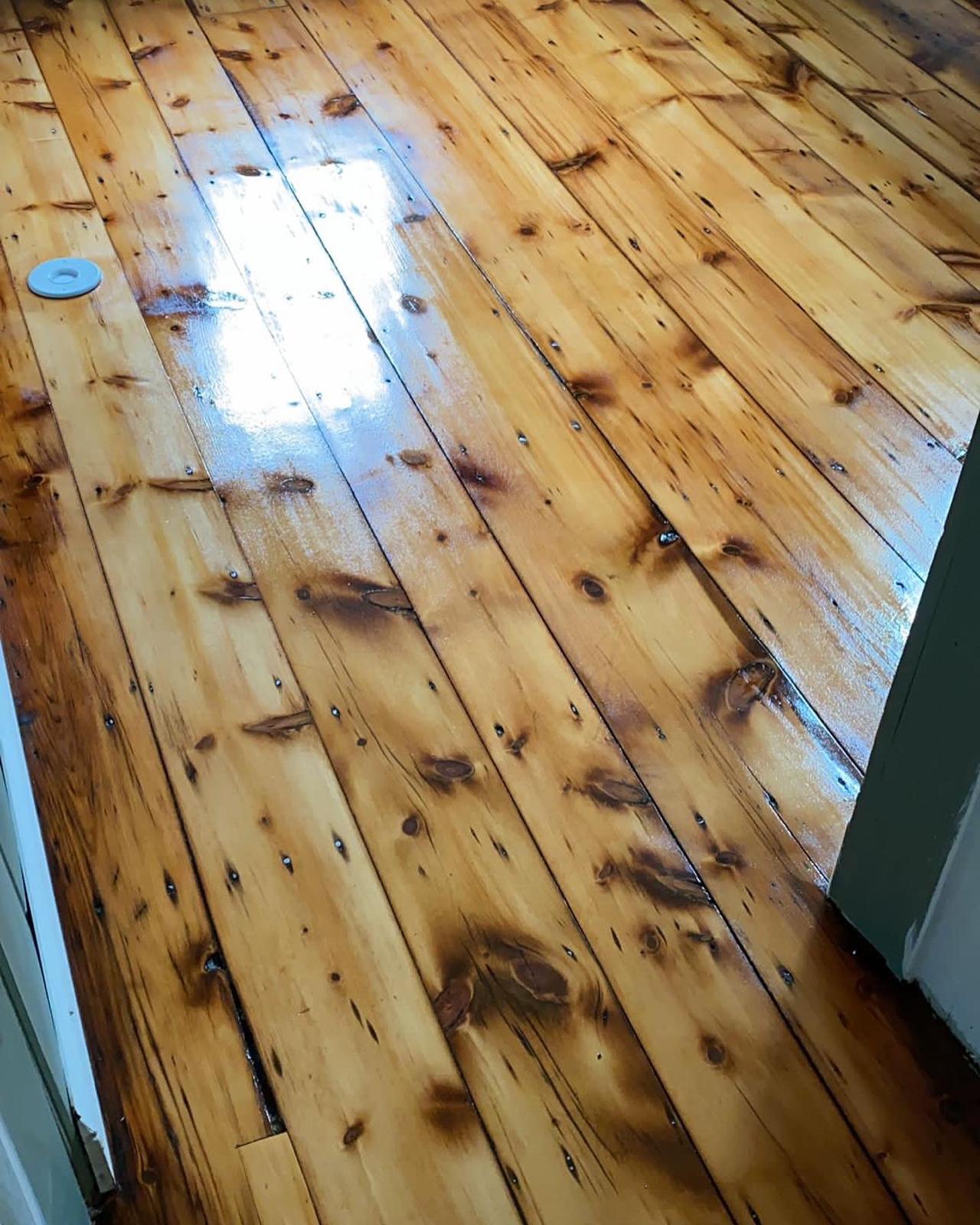 Knotty pine hardwood floor with a glossy finish